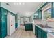 Bright kitchen with granite countertops and stainless-steel sink at 800 N Walton Ave, Tarpon Springs, FL 34689
