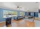 Bright living room featuring hardwood floors, stylish furniture, and ample natural light at 800 N Walton Ave, Tarpon Springs, FL 34689