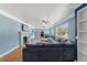 Open living room with hardwood floors, fireplace, and a large sofa at 800 N Walton Ave, Tarpon Springs, FL 34689
