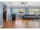 Inviting living room showcasing hardwood floors, a blue accent wall, and comfortable seating at 800 N Walton Ave, Tarpon Springs, FL 34689