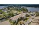 Overhead view of a waterfront condo building boasting private docks, tropical landscaping, and ample parking at 8210 Aquila St # 218, Port Richey, FL 34668