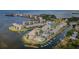 Expansive aerial view of waterfront community featuring condos, tennis courts, and boat docks at 8210 Aquila St # 218, Port Richey, FL 34668