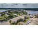 Aerial view of canal-front condo building, showing neighborhood location with water access and parking at 8210 Aquila St # 218, Port Richey, FL 34668