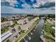 Gorgeous aerial of waterfront condos with docks, set against ocean and lush green landscapes at 8210 Aquila St # 218, Port Richey, FL 34668