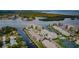 Stunning aerial view of waterfront condos with boat docks, pools, and meticulously landscaped grounds at 8210 Aquila St # 218, Port Richey, FL 34668