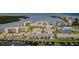 Aerial view of a waterfront condo community with boat docks and lush landscaping at 8210 Aquila St # 218, Port Richey, FL 34668