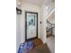 Cozy condo entryway features stairs and nautical-themed decor including a welcome mat at 8210 Aquila St # 218, Port Richey, FL 34668