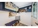 Charming entryway with beach decor, storage bench and decorative wall art, creating a welcoming coastal ambiance at 8210 Aquila St # 218, Port Richey, FL 34668