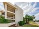Side view of a well-kept condo complex with maintained landscaping and exterior architecture at 8210 Aquila St # 218, Port Richey, FL 34668
