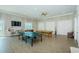 Well-lit game room with ping pong table, billiards, and foosball for recreational fun at 8210 Aquila St # 218, Port Richey, FL 34668