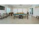 Well-lit game room with ping pong, foosball, and billiards offers residents entertainment at 8210 Aquila St # 218, Port Richey, FL 34668