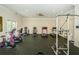Well-equipped fitness center with treadmills, elliptical machines, stationary bikes, and weight machines at 8210 Aquila St # 218, Port Richey, FL 34668