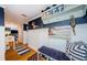 Charming hallway features blue accent wall, beadboard paneling, and hardwood floors at 8210 Aquila St # 218, Port Richey, FL 34668