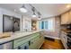 Modern kitchen featuring an island with granite countertops, stainless steel appliances, and plenty of cabinet space at 8210 Aquila St # 218, Port Richey, FL 34668
