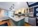 Well-lit kitchen with an island, modern appliances, and ample storage, offering a functional and stylish cooking space at 8210 Aquila St # 218, Port Richey, FL 34668