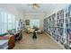 Cozy library with bookshelves, comfortable seating, and natural light for a relaxing read at 8210 Aquila St # 218, Port Richey, FL 34668