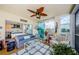 Bright sunroom with water view, wicker furniture and nautical decor at 8210 Aquila St # 218, Port Richey, FL 34668