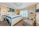 This stylish main bedroom features a comfortable chair, side tables, and decor at 8210 Aquila St # 218, Port Richey, FL 34668