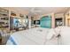 A serene main bedroom features comfortable seating, stylish decor, and a view to the water at 8210 Aquila St # 218, Port Richey, FL 34668