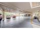 Spacious parking garage with ample parking spots, white pillars, and overhead lighting at 8210 Aquila St # 218, Port Richey, FL 34668
