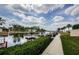 Beautiful waterfront view with private boat docks, lush greenery, and a serene waterway at 8210 Aquila St # 218, Port Richey, FL 34668