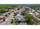 An aerial view of a community with mature trees and manicured lawns at 8600 N Briar Patch Dr, Port Richey, FL 34668