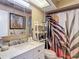 Bright bathroom featuring a new vanity and storage shelves with a stylish shower curtain at 8600 N Briar Patch Dr, Port Richey, FL 34668