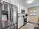 Kitchen features stainless steel appliances, white cabinets, and sleek countertops at 8600 N Briar Patch Dr, Port Richey, FL 34668
