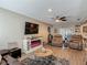 Inviting living room featuring an entertainment center with a fireplace, comfortable seating, and modern flooring at 8600 N Briar Patch Dr, Port Richey, FL 34668
