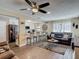Living room featuring an open floor plan to the kitchen and bar seating, offering a modern design at 8600 N Briar Patch Dr, Port Richey, FL 34668
