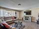 Bright living room featuring a sectional sofa, modern decor, and views of the outdoor scenery at 8600 N Briar Patch Dr, Port Richey, FL 34668