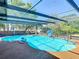 Inviting screened pool with crystal clear water, plenty of room, and outdoor enjoyment at 8600 N Briar Patch Dr, Port Richey, FL 34668