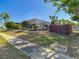 Lovely pool view of a fenced in backyard with a screened in patio at 8600 N Briar Patch Dr, Port Richey, FL 34668
