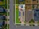An aerial view showing the property's layout, backyard oasis, solar panels, and proximity to neighborhood streets at 8630 Campus Woods Way, New Port Richey, FL 34655