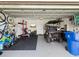 Spacious garage featuring ample storage, fitness equipment, and a convenient golf cart at 8630 Campus Woods Way, New Port Richey, FL 34655