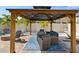 Charming gazebo with outdoor seating, a dining area, and inviting lighting for relaxing evenings at 8630 Campus Woods Way, New Port Richey, FL 34655