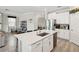 Gourmet kitchen features a large island, stainless steel appliances, and plenty of counter space at 8630 Campus Woods Way, New Port Richey, FL 34655