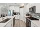 Spacious kitchen boasts stainless steel appliances, countertops, and ample storage at 8630 Campus Woods Way, New Port Richey, FL 34655