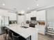 Beautiful kitchen features a large island with seating and modern stainless steel appliances at 8630 Campus Woods Way, New Port Richey, FL 34655