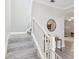 Carpeted staircase with white railing, leading to the upper level at 8630 Campus Woods Way, New Port Richey, FL 34655
