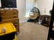 Bright bedroom featuring a unique egg chair, functional dresser, and lots of space at 9007 49Th E Ave, Palmetto, FL 34221