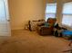 A bedroom featuring carpet flooring and a recliner at 9007 49Th E Ave, Palmetto, FL 34221