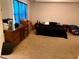Bedroom featuring carpeted flooring, a queen bed, and wooden dressers at 9007 49Th E Ave, Palmetto, FL 34221