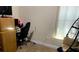 Showing a bedroom with an ergonomic chair and unique egg chair with natural light from the window at 9007 49Th E Ave, Palmetto, FL 34221