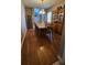 Inviting dining room features wood floors, a wooden table with six chairs, and a decorative china cabinet at 9007 49Th E Ave, Palmetto, FL 34221