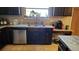 A kitchen sink with a stainless steel dishwasher below a window above at 9007 49Th E Ave, Palmetto, FL 34221