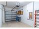 Spacious garage with epoxy flooring, storage shelves, and room for vehicles and equipment at 9103 Carolina Wren Dr, Tampa, FL 33626