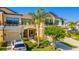 Attractive two-story townhouse boasts lush landscaping, a private balcony, and an attached garage at 9103 Carolina Wren Dr, Tampa, FL 33626