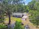 Aerial view features large backyard with storage sheds at 9226 Dan Lynn St, Brooksville, FL 34601