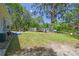 Spacious backyard with storage sheds, mature trees, and a hammock at 9226 Dan Lynn St, Brooksville, FL 34601